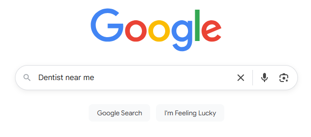 Google search interface displaying "Dentist near me" query, emphasizing local SEO for healthcare practices.