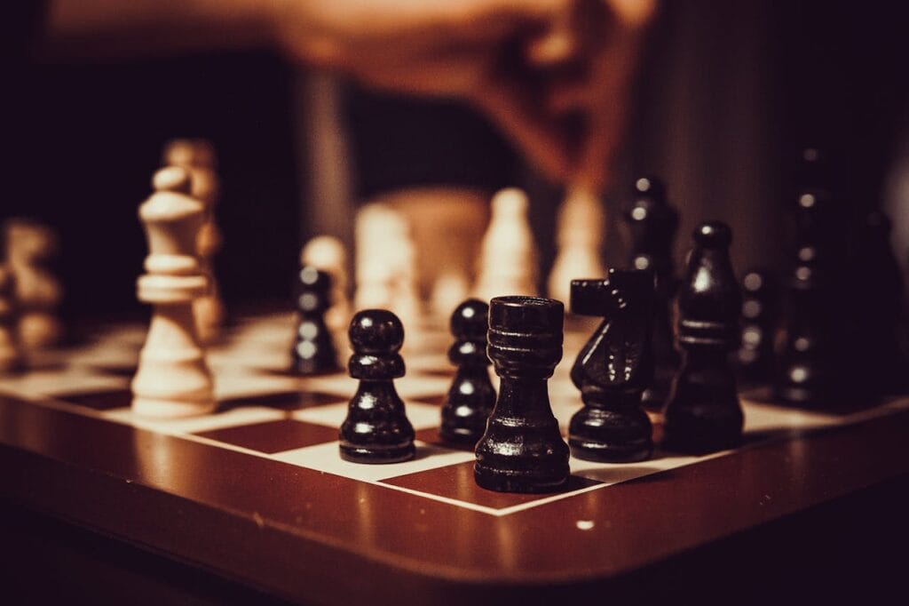 Chess pieces on a board, highlighting strategic gameplay and engagement, representing decision-making and competition in a local context.